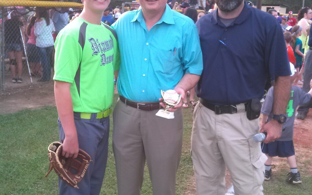 Warren Montgomery throws out the 1st pitch at the Franklinton Baseball League Opening Ceremony