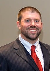 Collin Sims speaks at Candlelight Vigil for Domestic Violence Awareness Month
